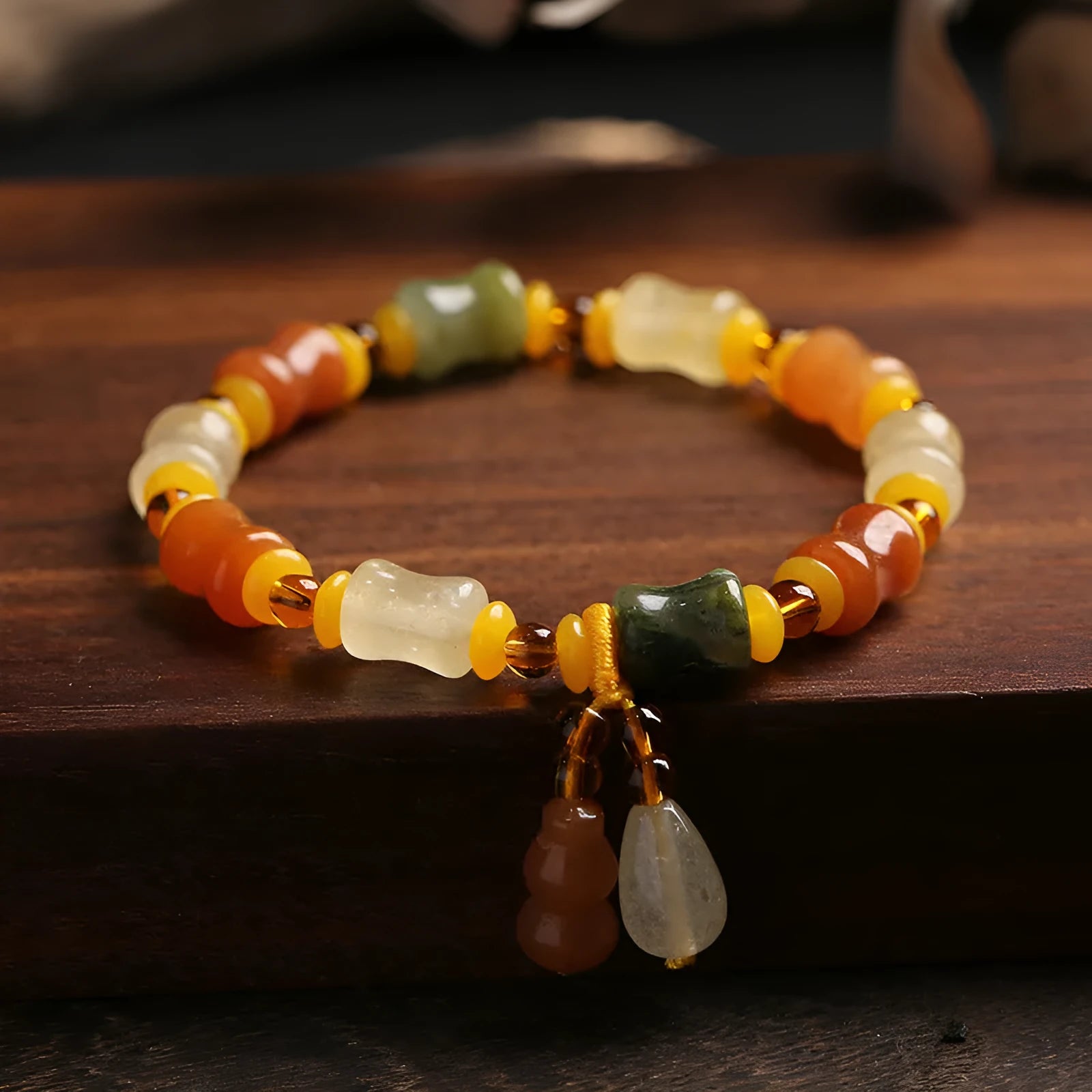 Jinsi Jade bracelet with small bone beads showing auspicious patterns and geometric design