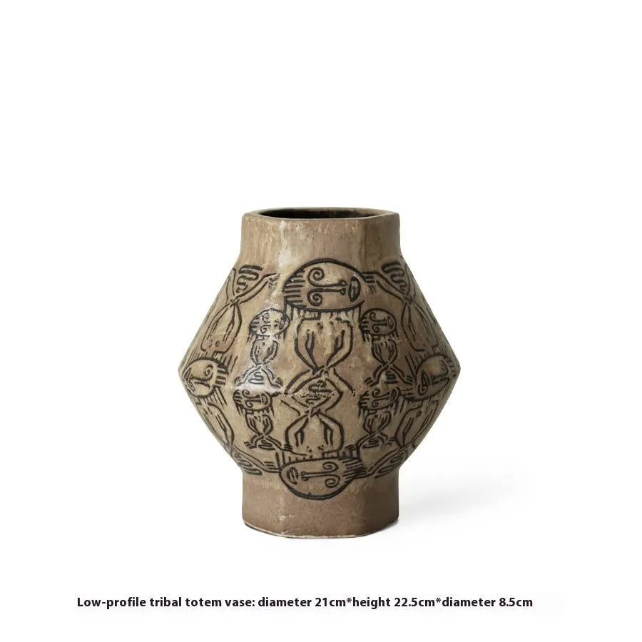 Hand-painted ceramic vase with vintage carved religious patterns in cylindrical shape