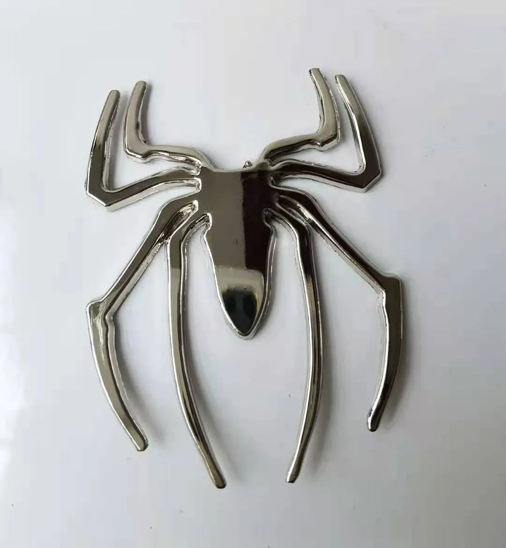 Zinc alloy 3D metal spider car sticker in gold, silver, black, and red colours.