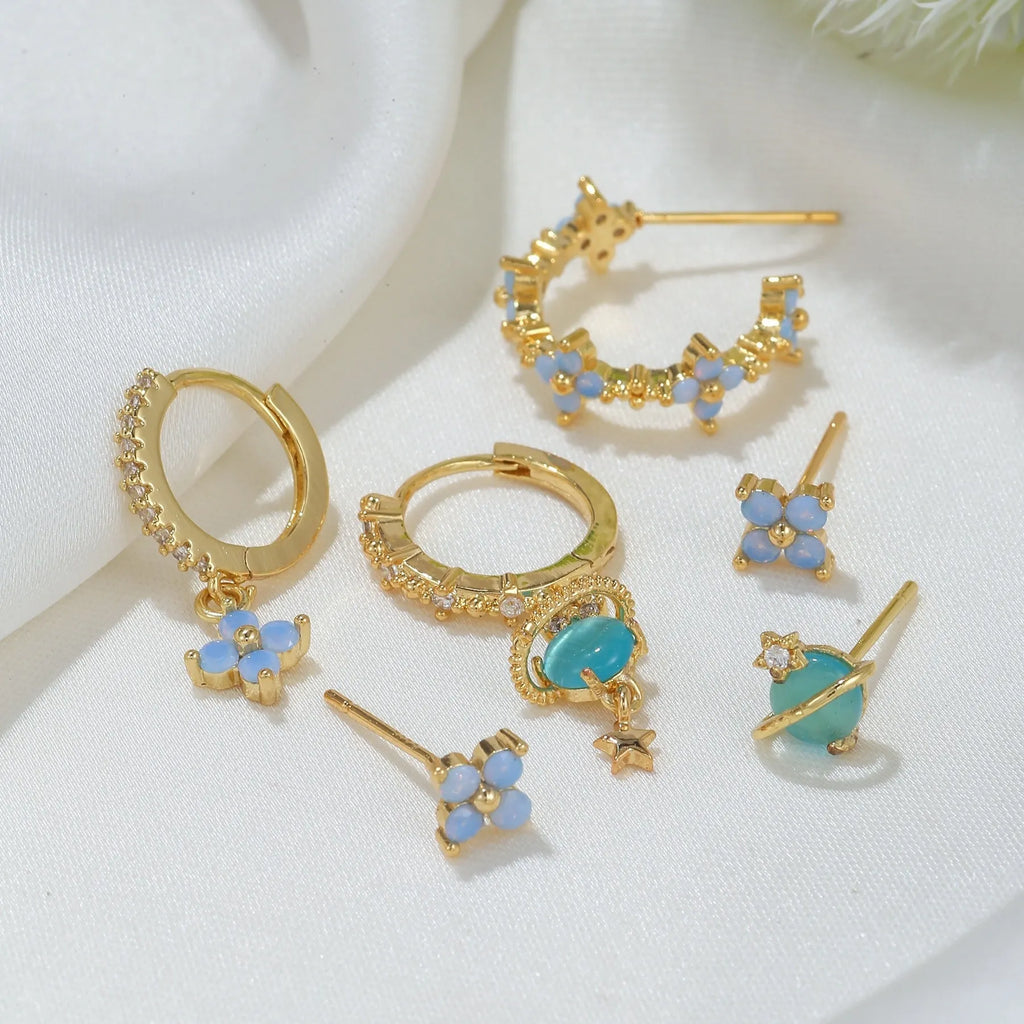 Gold and silver floral stud earrings with blue protein stone mosaic design.