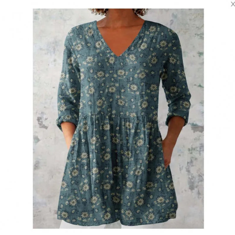 Women's printed wave pattern loose dress with wide waist and 3/4 length sleeves.