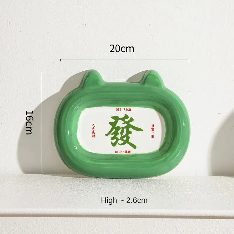 Ceramic pet bowl with an animal design, shown on a table.