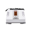 White intelligent window cleaning robot with compact design on a window pane