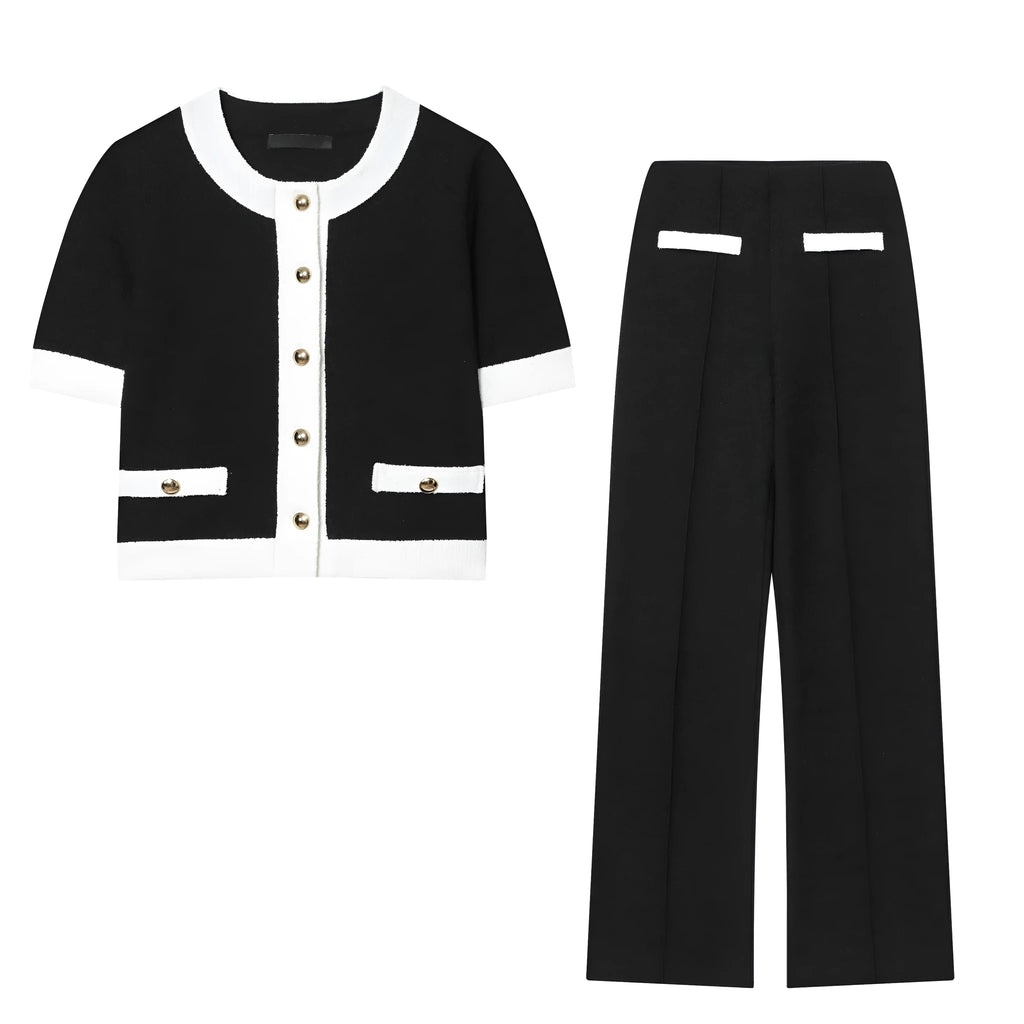 Women's two-piece suit with beaded round-neck top and high-waisted trousers on a hanger.