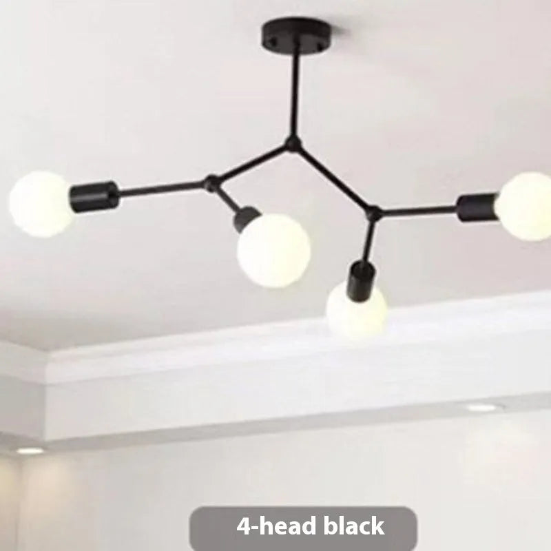 Nordic style iron ceiling chandelier with multiple black heads against a white background.