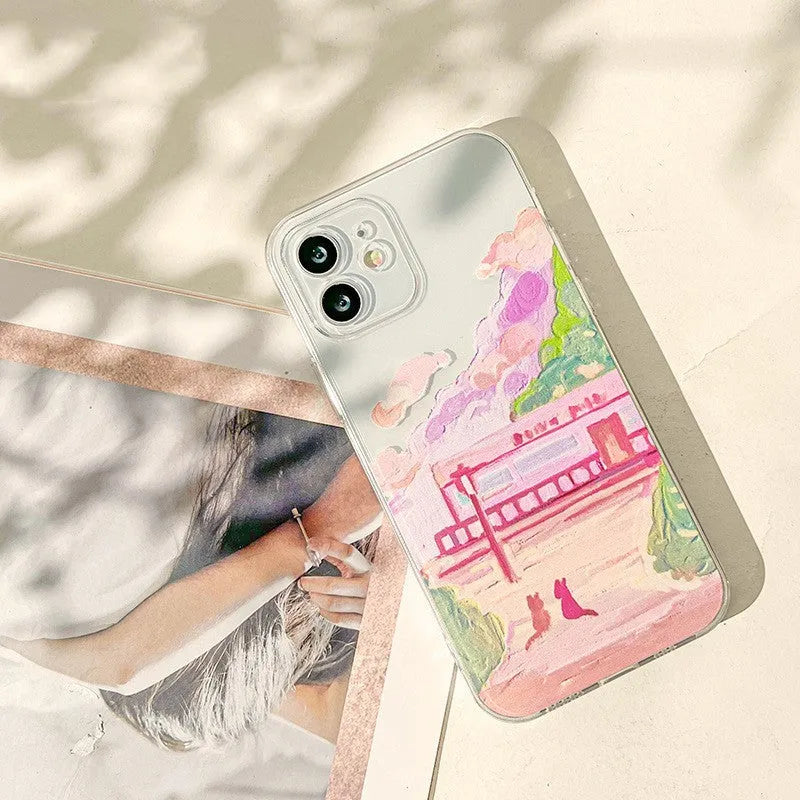 Soft silicone mobile phone case for iPhone with a printed two cat cartoon design on a white background.