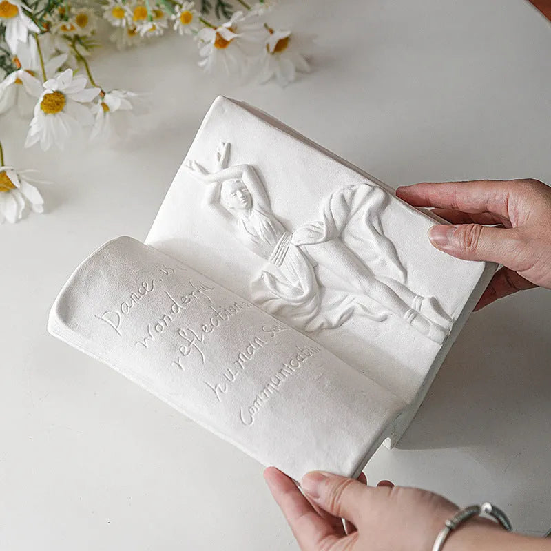 Glazed ceramic book stand in modern simplicity style on a desktop.
