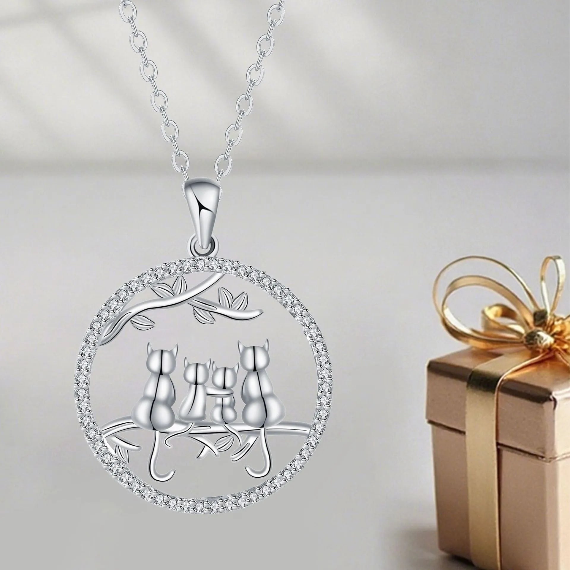 Women's copper necklace with four kitten pendants on cross chain