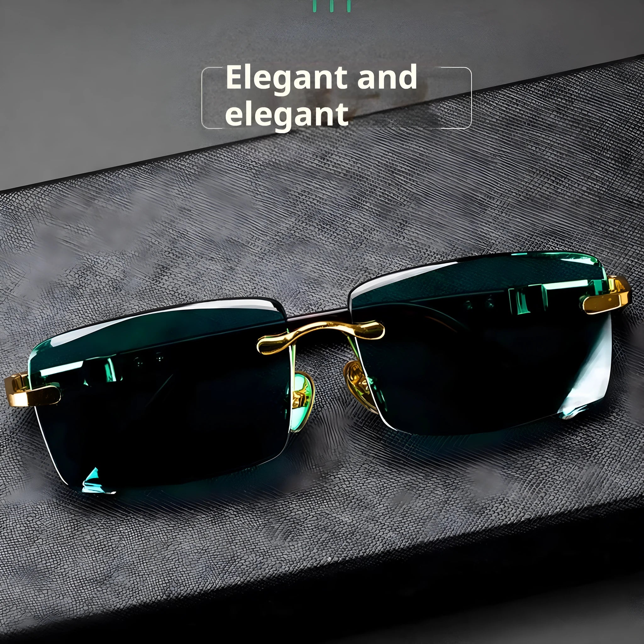 A pair of dark green frameless crystal sunglasses with a gold-tone temple arm on a case.