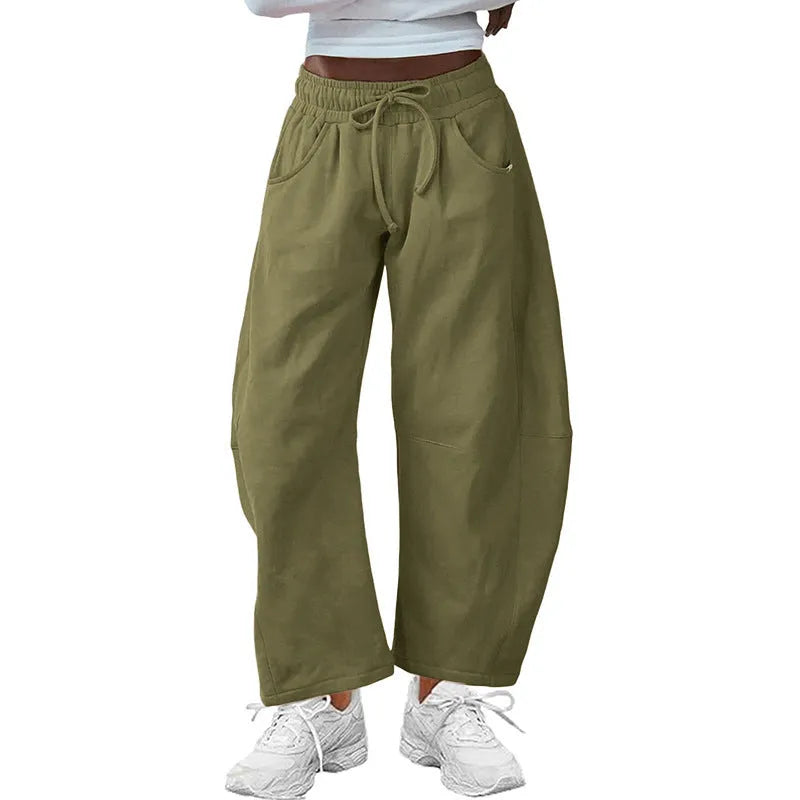 Women's loose cropped sweatpants with drawstring elastic waist and side pockets in street fashion style