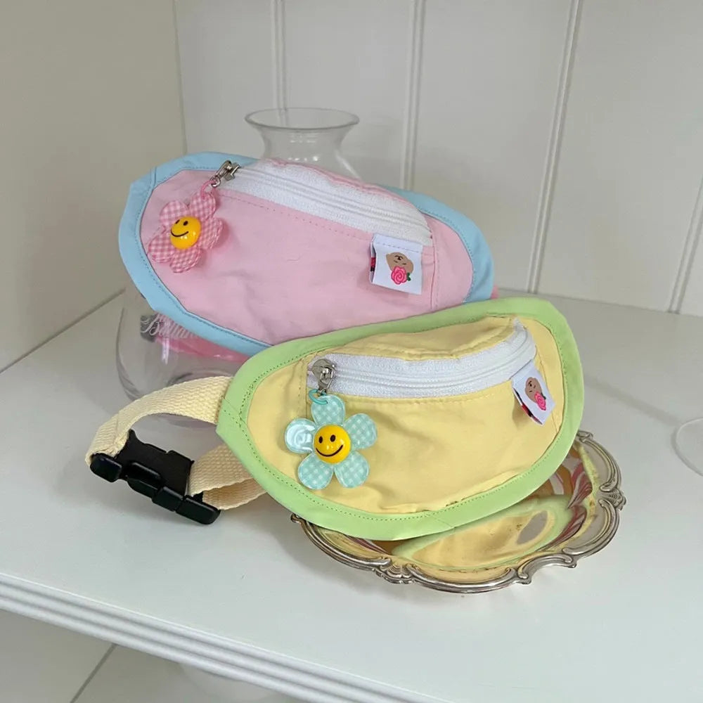Powder blue backpack-style pet carrier for a small dog, shown with adjustable straps and messenger bag handle.