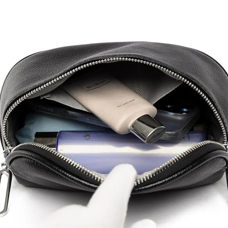 Women's soft PU messenger bag in saddle shape with single shoulder strap and zippered interior compartment