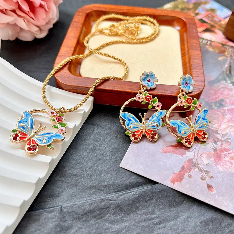 Vintage metal butterfly and petal stud earrings and pendant necklace set for women