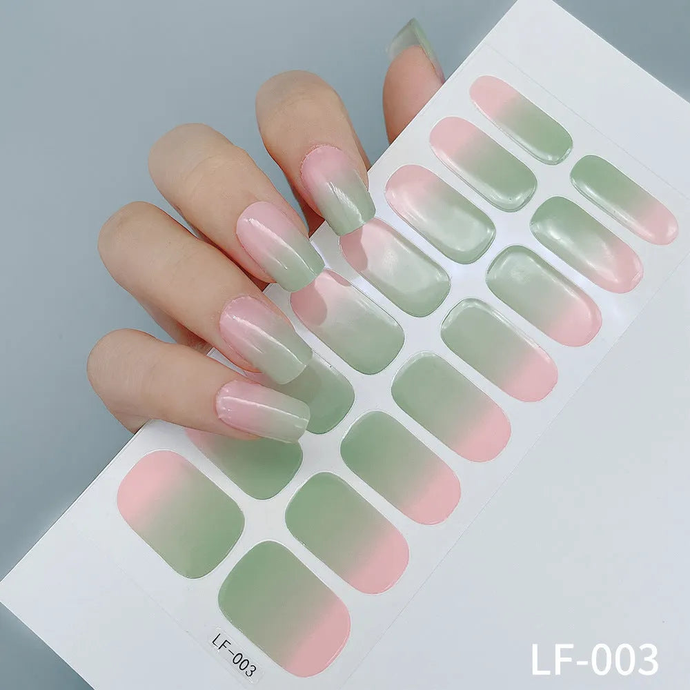 Full sheet of nail art stickers showing sixteen small designs including cross, rose, tulip, and leopard print patterns.