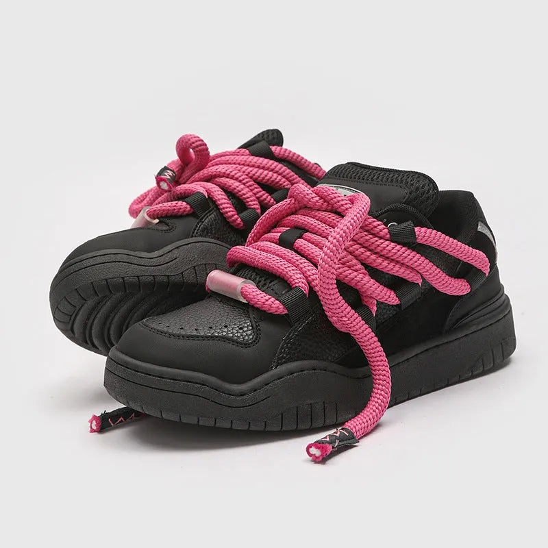 Pair of casual unisex lace-up shoes with thick rubber sole, shown in a choice of colours.