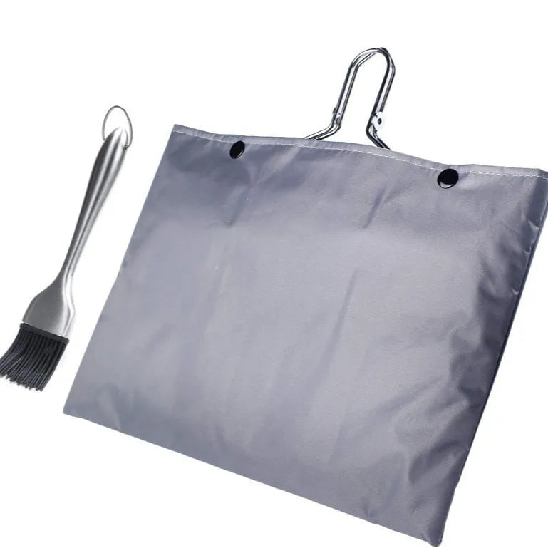Stainless steel square barbecue grill mesh basket with a folding frame and a cleaning brush.