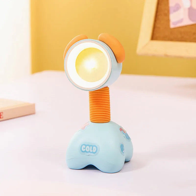 DIY cartoon animal small night lamp with magnetic base in assorted colours on a desk.