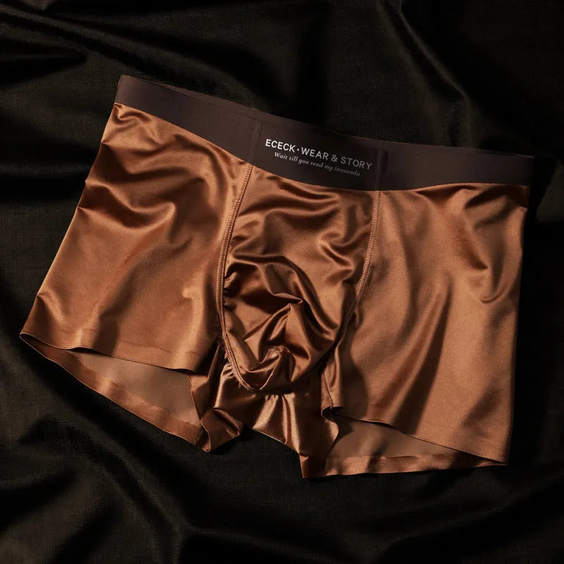 Men's colourblock Ice Silk seamless underwear in blue, brown, gray, and white colours.