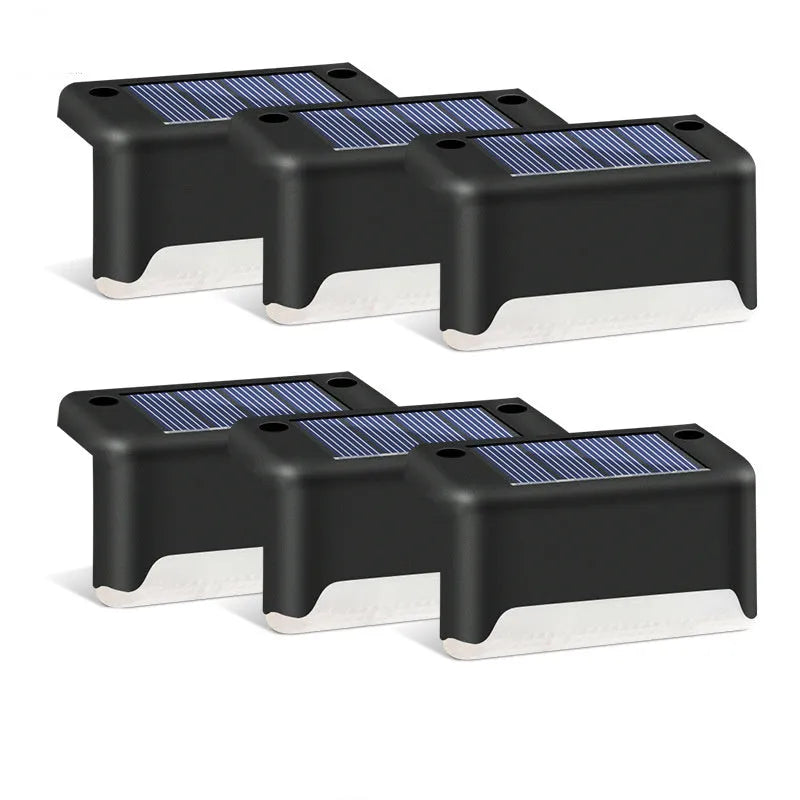 Black solar stair light with ABS housing on outdoor steps, 75x44x42mm IP55 rated