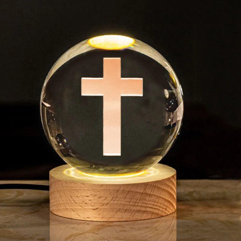 White crystal cross ornament with 6cm ball on wooden warm light base
