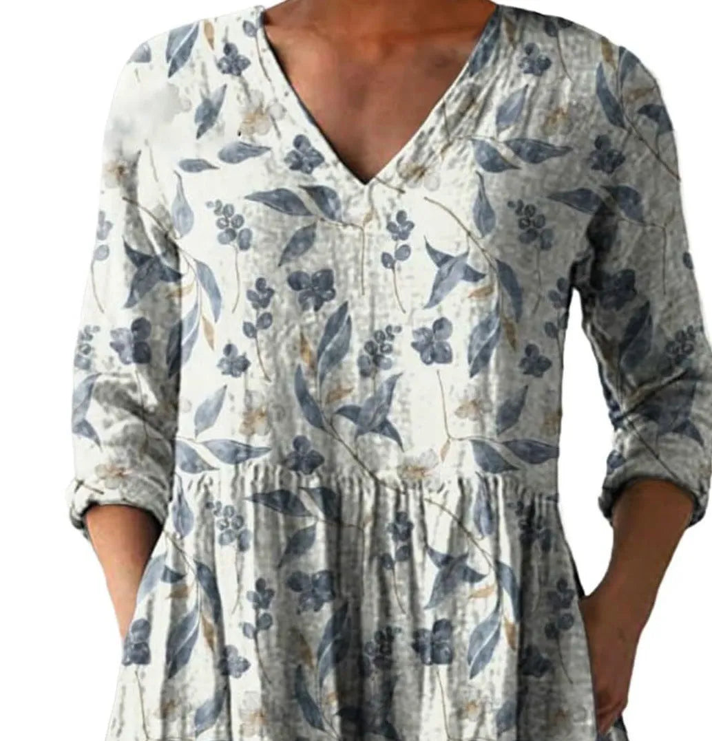 Women's printed wave pattern loose dress with wide waist and 3/4 length sleeves.