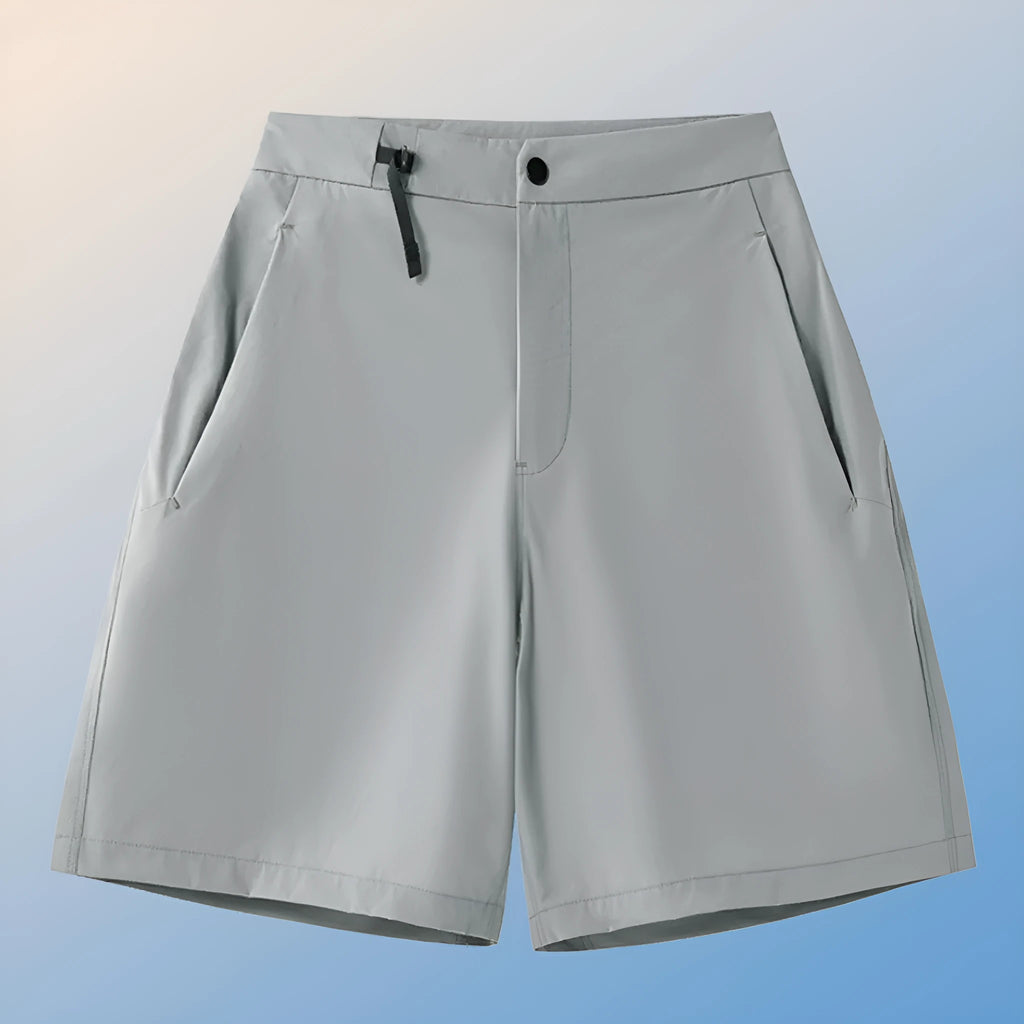 Men's solid colour quick-dry sports shorts with elastic sides on a neutral background.