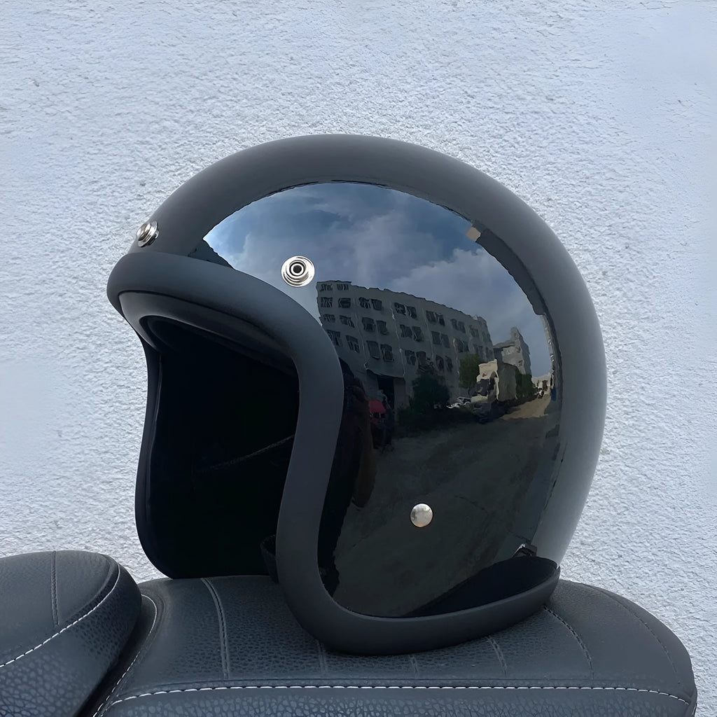 Retro-style half motorcycle helmet in fibreglass, shown in a cement grey colour option.