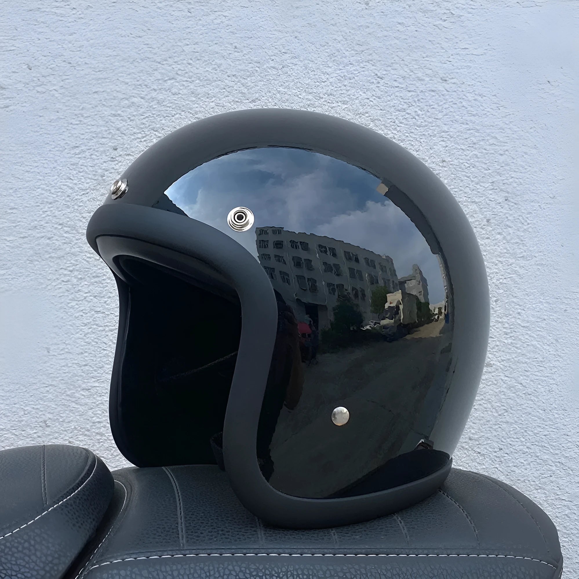 Retro-style half motorcycle helmet in fibreglass, shown in a cement grey colour option.