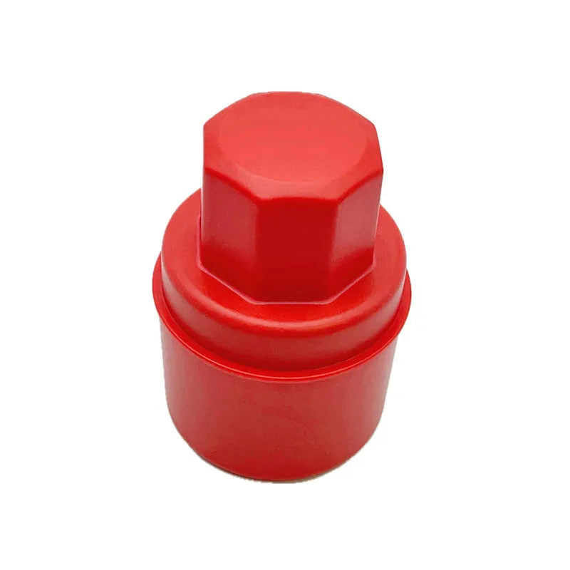 Black and red car tyre polishing sponge brushes with lids on a tyre sidewall