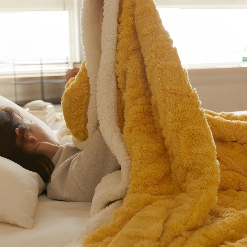 Polyester thermal flannel blanket in beige colour, shown folded to display its thick texture and modern style