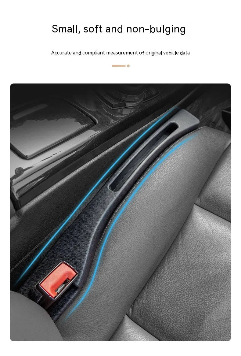 Black plastic car seat gap storage organiser box with handle inserted between car seat and centre console.