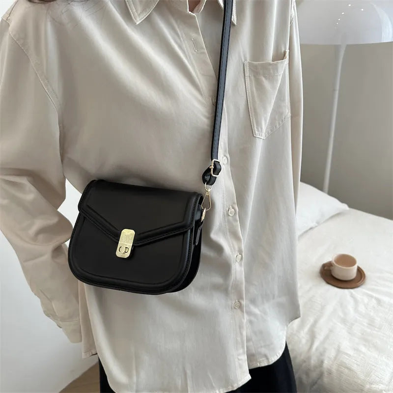 Niche texture shoulder messenger bag in soft PU leather with clamshell opening and horizontal square shape