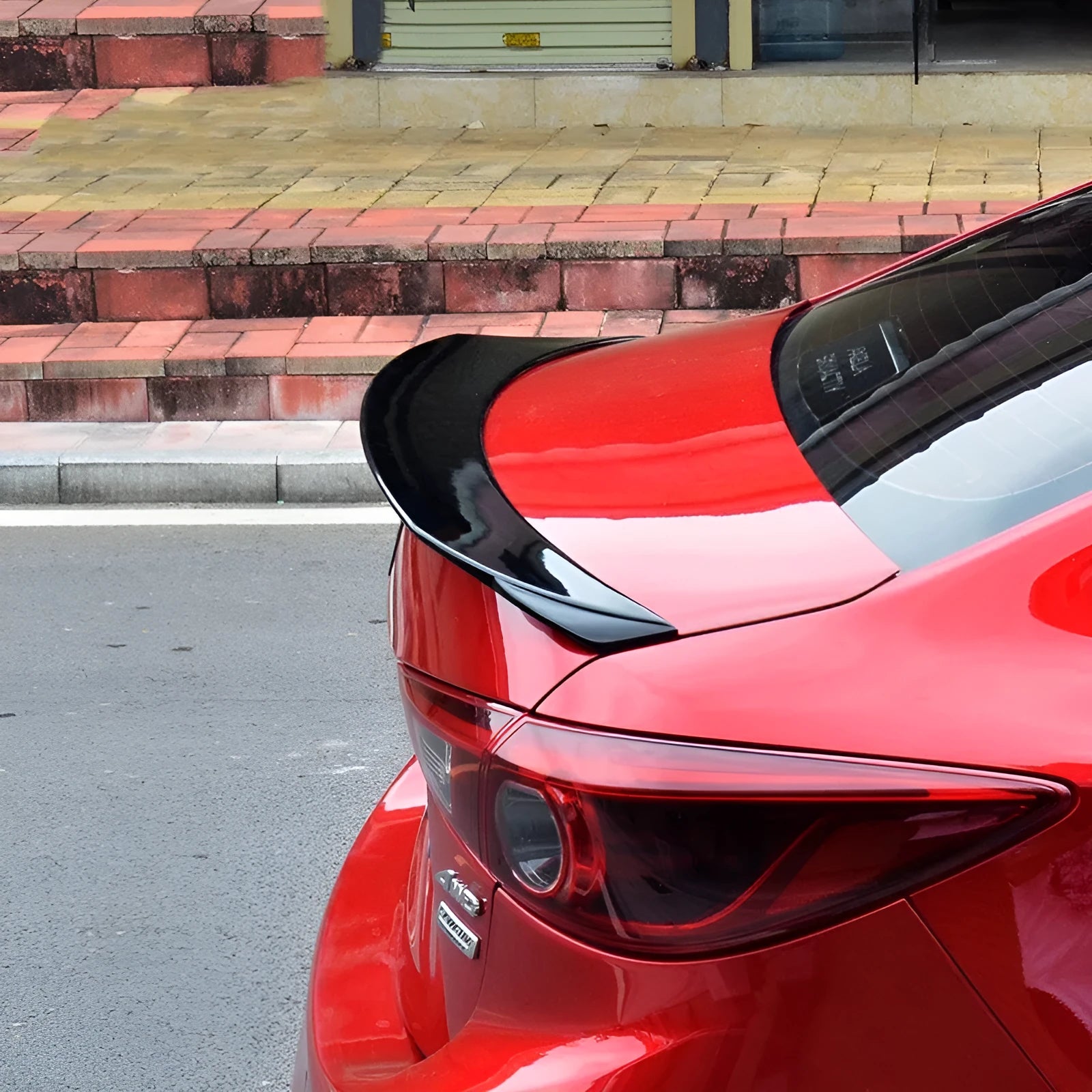 Large bright black fixed wing tail trim spoiler for a Mazda 3 Axela Exela