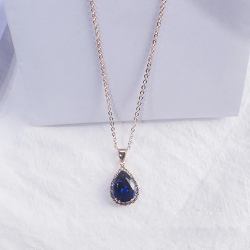 Rose gold geometric drop shape necklace with rhinestones in pink colour option