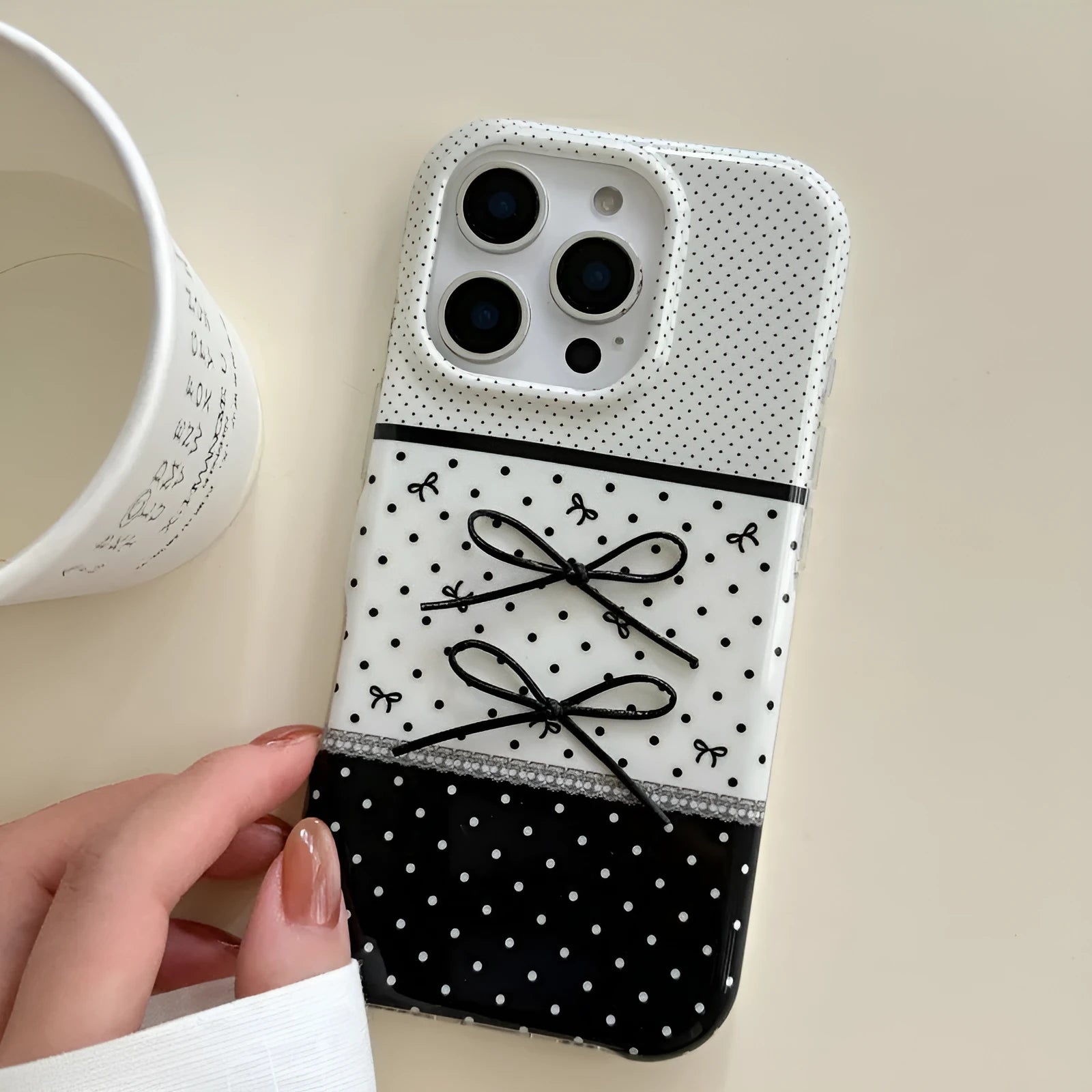 Black and white polka dot stitching stereo bow silicone phone case for iPhone