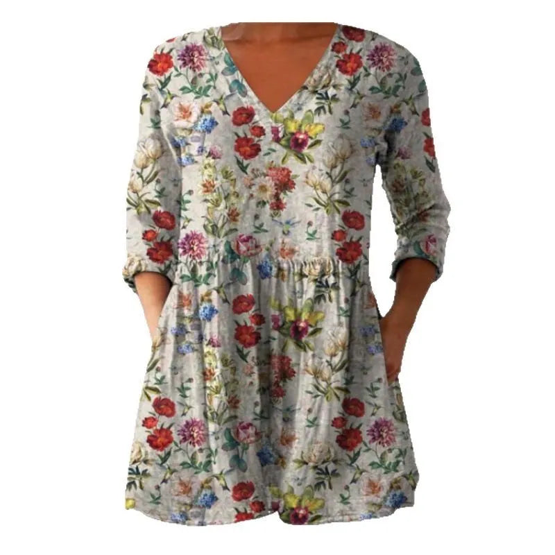 Women's printed wave pattern loose dress with wide waist and 3/4 length sleeves.