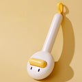 Small yellow duck-shaped pet grooming comb with needle teeth for cats and dogs