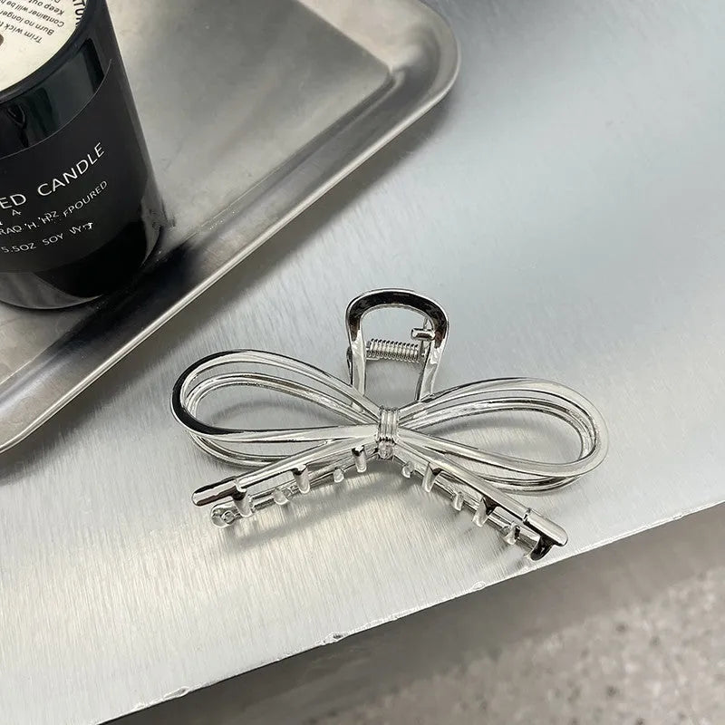 Korean style bow barrettes for women in gold and silver alloy metal with secure back head grip