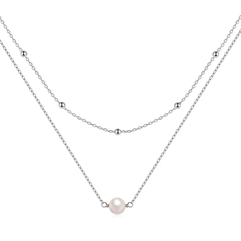 S925 sterling silver double layer necklace with twin geometric pearls in gold or white gold plating.