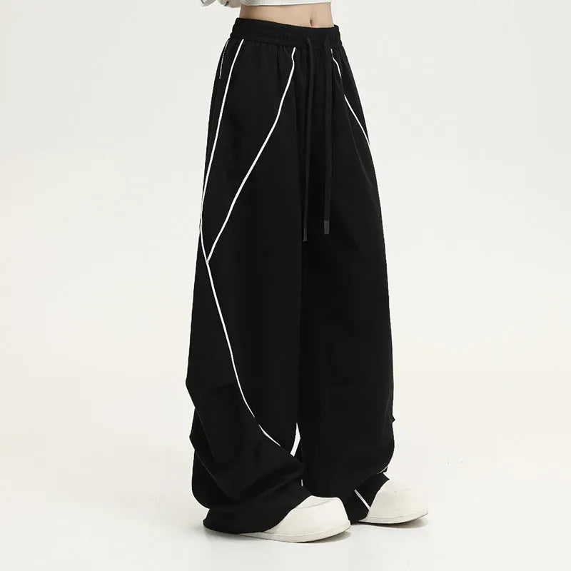Black pleated hip hop trousers with wide legs and striped pattern