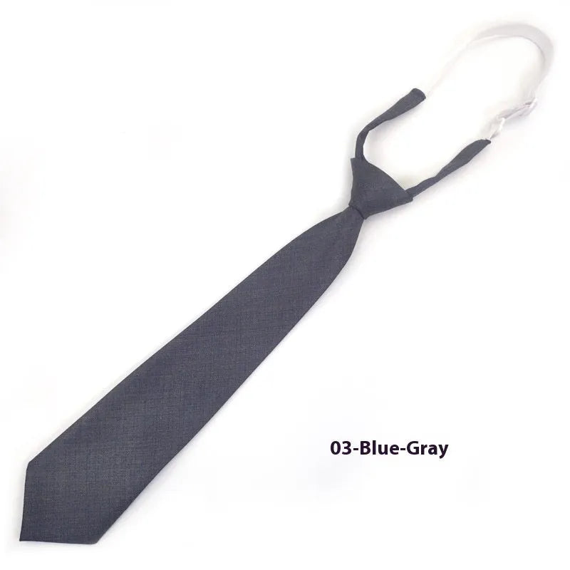 Men's navy blue cotton bow tie with arrow style on a plain background.