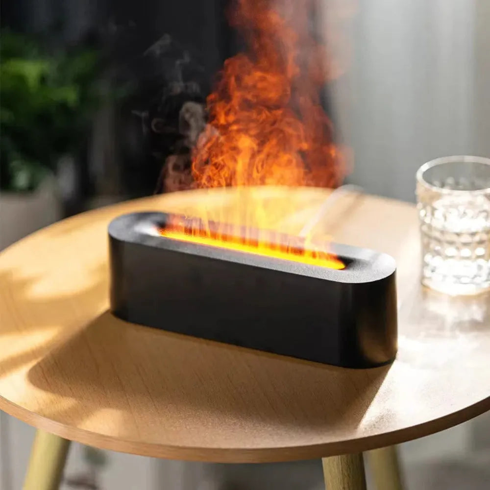 Square black creative lava flame USB desktop humidifier and essential oil diffuser on a desk.