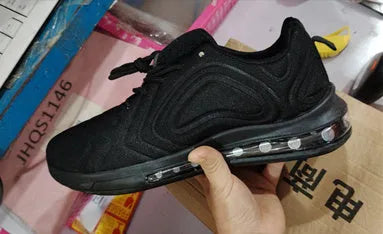 Men's black casual air cushion sneakers with a thick sole and round toe design.