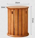 Stackable round iron dining stool in a modern style, shown in a choice of colours.