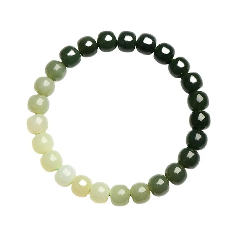 Natural Hetian jade bracelet showing water gradient colour variation on polished surface