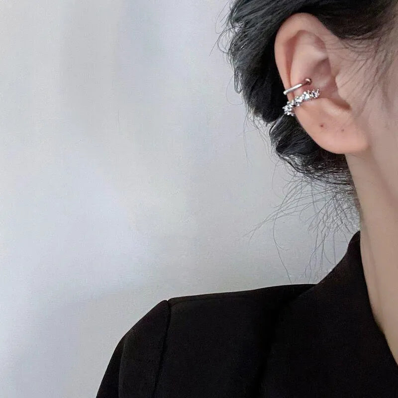 Pair of silver-toned geometric clip-on earrings with a frosty textured finish.