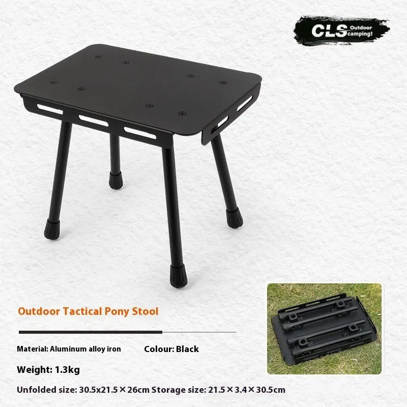CLS aluminium alloy dual-use folding camping table shown converted into a stool with a green PU mat cushion.