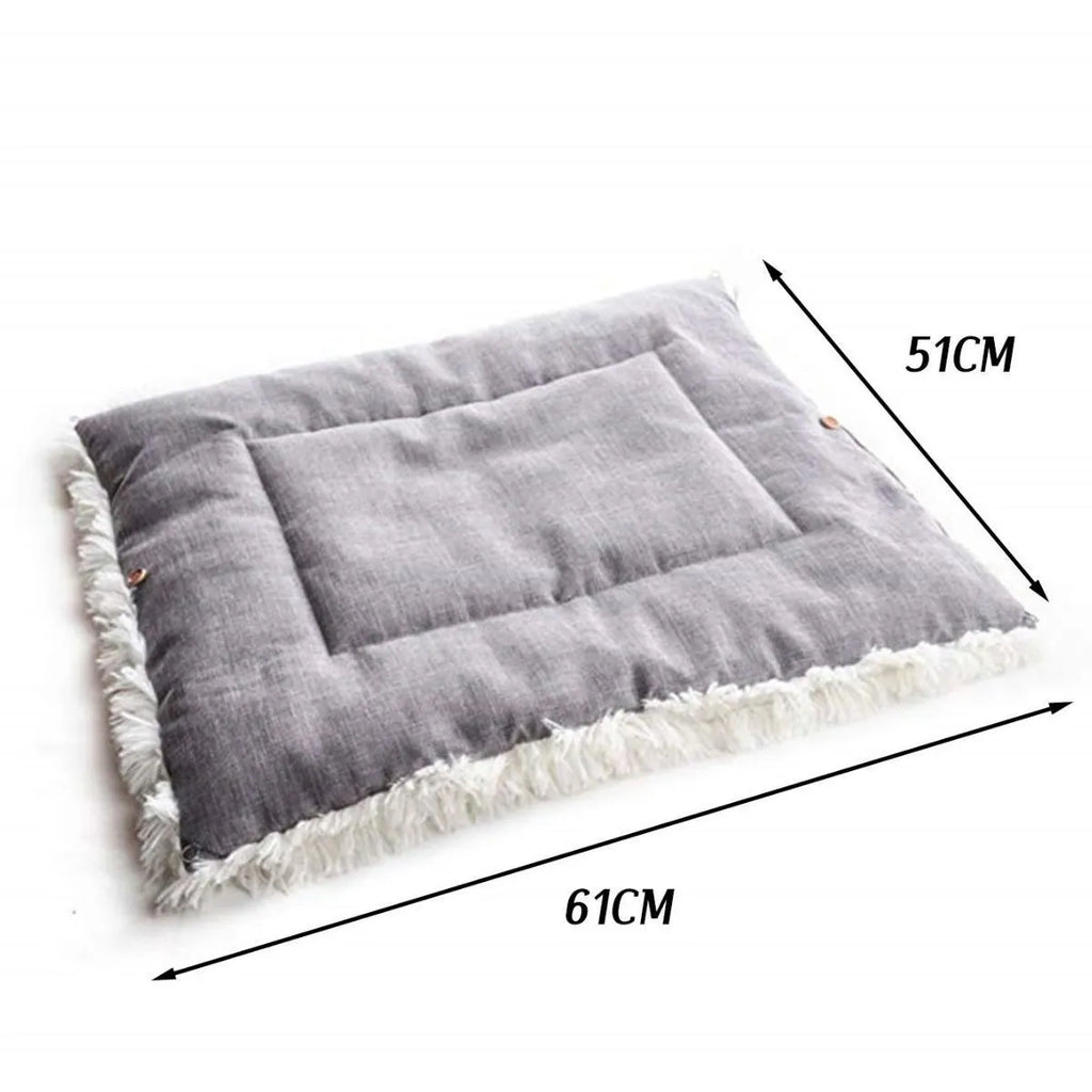 Grey or white pet blanket with long plush hair measuring 61cm by 51cm with non-slip black bottom