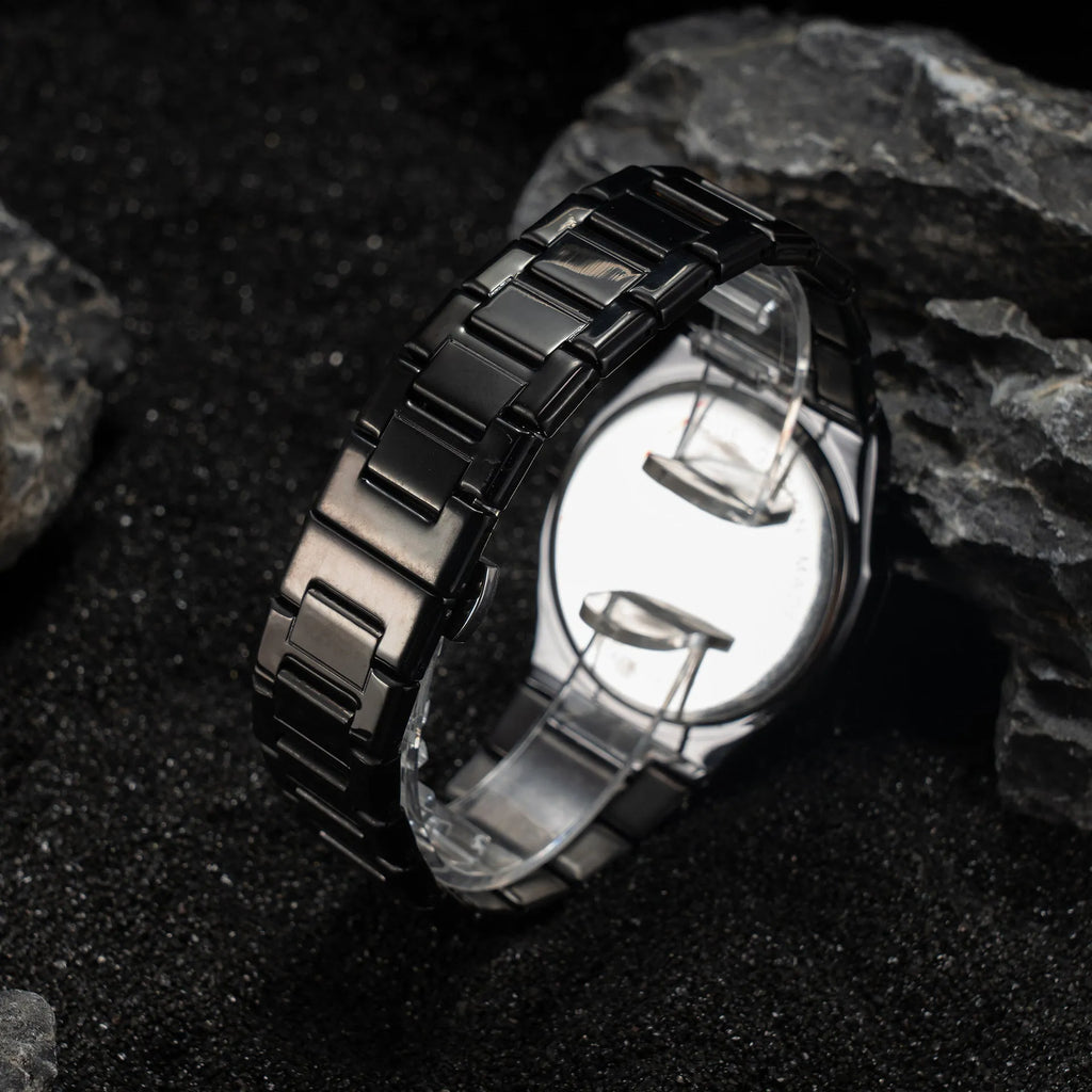 Men's steel belt business watch with quartz movement and 10mm thickness on wrist.
