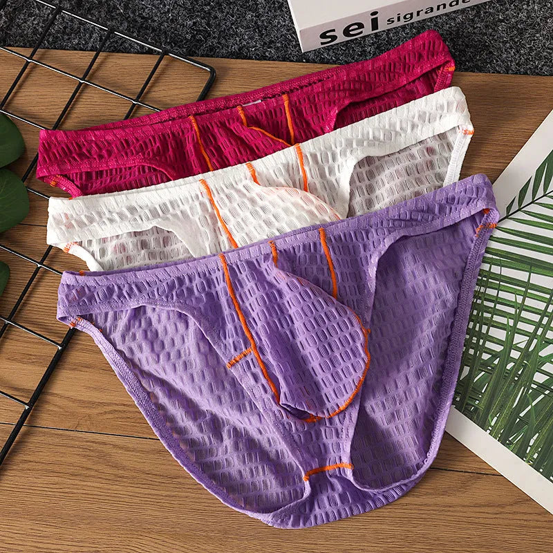 Men's low waist lace briefs in white, black, green, rose red, or light purple on a plain background.